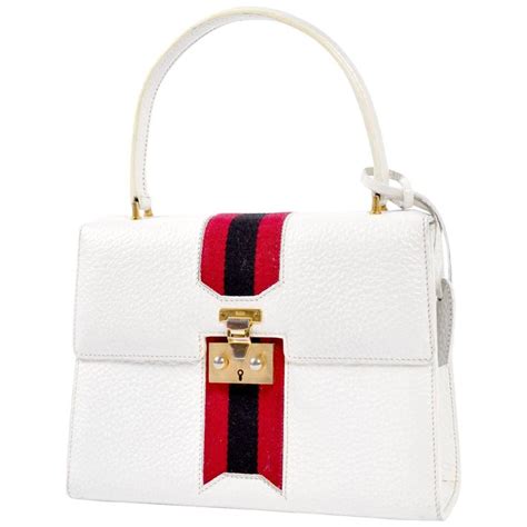 202744 cbb701064 gucci|white Gucci handbag.